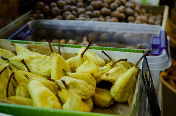 Dried dried apricots, raisins and persimmons closeup. Colorful dried fruits stall background.