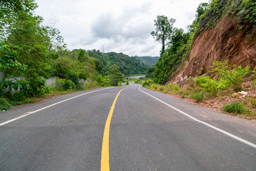 Asphalt road Empty road with mountains on background.