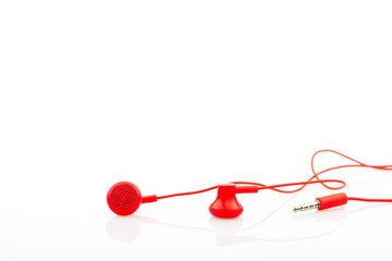 Close up Red earphone isolated on white background.