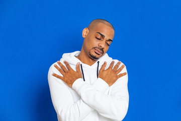 African guy wearing a white sweatshirt