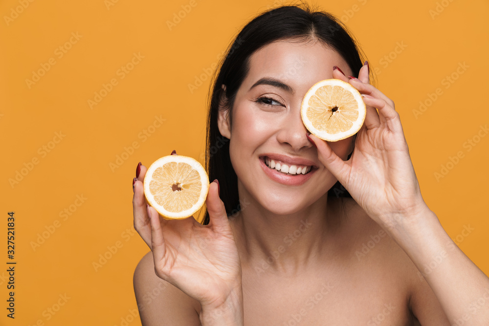 Canvas Prints beauty portrait of young half-naked woman smiling and holding lemon parts