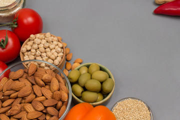 Healthy food for diet and lifestyle. Set of vegetables, beans nuts, quinoa bulgur, chickpeas. Gray  background.