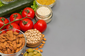 Balanced food set, green red vegetables, seeds nuts.
