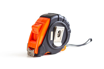 Measuring tape measure made of black and orange plastic, on a white background