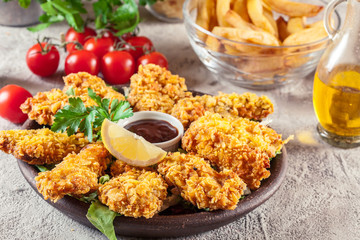 Chicken strips in cornflakes breadcrumb