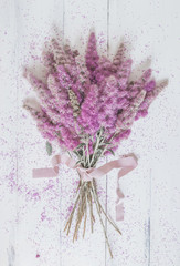 bouquet of pink flowers on a white background. top view