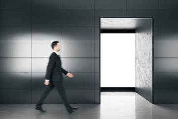 Businessman walking in contemporary gallery