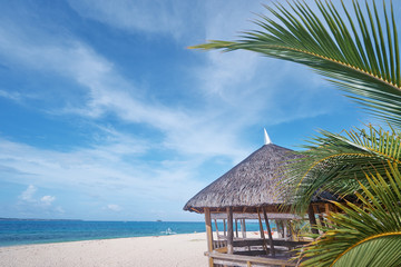Beautiful tropical resort on white sand beach.