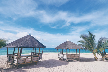 Beautiful tropical resort on white sand beach.