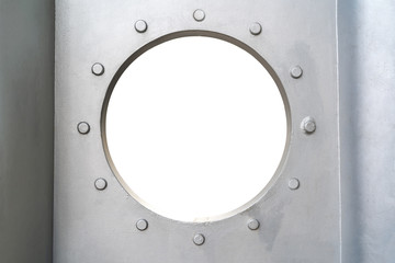 Round hole in a metal structure. A hole in the iron wall.