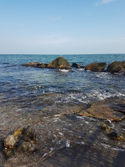 Fototapeta na wymiar beautiful landscape with the azure sea with a stone coast