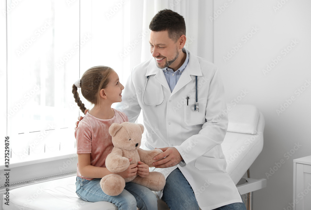 Wall mural children's doctor working with little patient in clinic