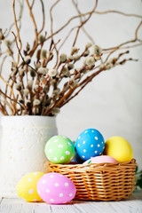 Happy Easter. Congratulatory easter background. Easter eggs and flowers. Background with copy space. Selective focus.