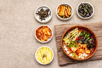 Traditional Korean spicy soup with kimchi, tofu, vegetables. Hot dish for healthy meal