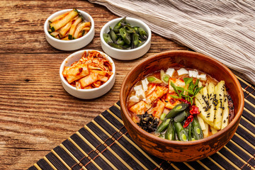 Traditional Korean spicy soup with kimchi, tofu, vegetables. Hot dish for healthy meal