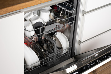 Open new dishwasher. Dishwasher in the kitchen