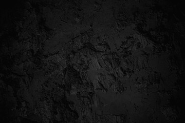 Dark aged shabby stone cut surface. Coarse, rough gray or black stone or rock texture of mountains layer, background and copy space for text on theme geology study.