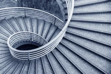 Fotobehang Trappen Empty modern spiral stairway, viewed from top  © leeyiutung