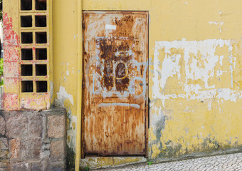 Exterior and door of colorful abandoned house