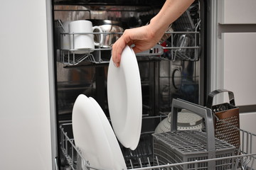 Open new dishwasher. Dishwasher in the kitchen