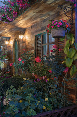 Fototapeta na wymiar Landscaped backyard flower garden of residential house