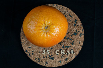 a series of calorie grapefruit products 35 kcal per 100 grams on a black background