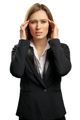 Feeling awful headache. Depressed young business woman holding head in hands and keeping eyes closed while standing isolated on white background.