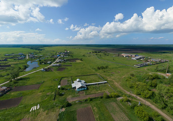 Aerial view of Lipovskoe village. A lot of grass and trees. Russia, Sverdlovsk region