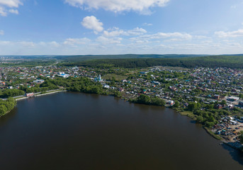 Aerial view of private houses near the bank of Iset river in Ekaterinburg city. Summer day, sunny. Russia