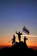 Three armed soldiers with the Thai  flag