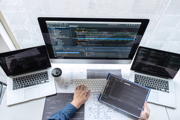 Developer programmer working on project in software development computer in IT company office,...