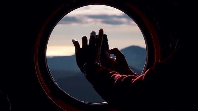 A telephone shot at a helicopter window in the mountains