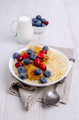 Wheat porridge with fruit and berries