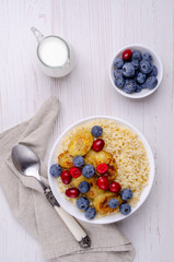 Wheat porridge with fruit and berries