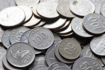 100 won pile of Korean coins'