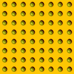 Limes pattern on yellow background. Creative food concept. Flat lay