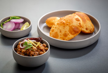 choley bhature is a dish originated initially in the northern part of the Indian subcontinent.  It is a combination of chana masala and bhatura, a fried bread made from maida.