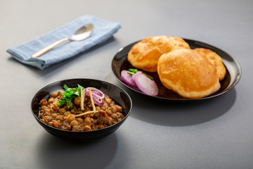 choley bhature is a dish originated initially in the northern part of the Indian subcontinent.  It is a combination of chana masala and bhatura, a fried bread made from maida.