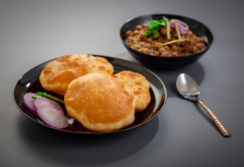 choley bhature is a dish originated initially in the northern part of the Indian subcontinent.  It is a combination of chana masala and bhatura, a fried bread made from maida.