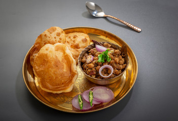 choley bhature is a dish originated initially in the northern part of the Indian subcontinent.  It is a combination of chana masala and bhatura, a fried bread made from maida.
