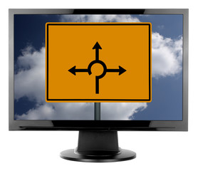 Monitor mit Kreisverkehrschild und Wolken