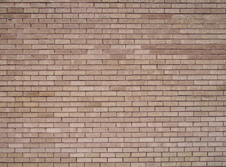a full frame light brown textured brick wall background