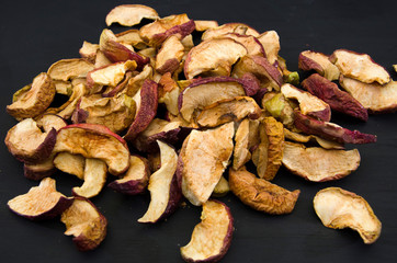 dried apples on a black background.