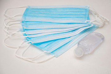 Disposable mask and hand sanitizer to prevent viruses spreading and protect yourself from influenza