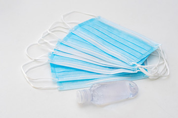Disposable mask and hand sanitizer to prevent viruses spreading and protect yourself from influenza