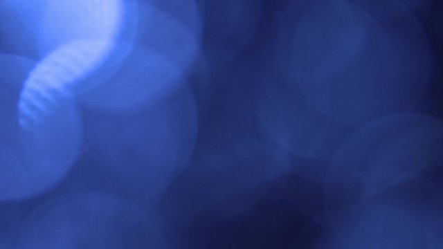 Blue bokeh light effect abstract background, animation of sparkle circles