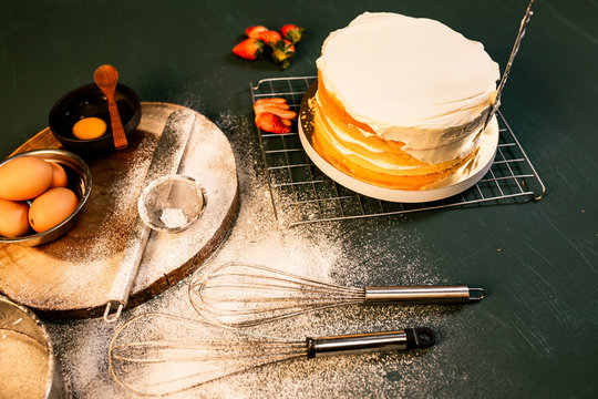 Carefully Icing The Cake And Decorating. Wedding cake with white fondant. step by step, multiple image.