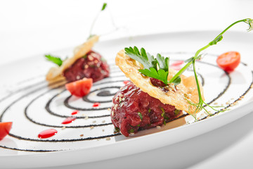 Beef tartare with cherry sauce and cardamom
