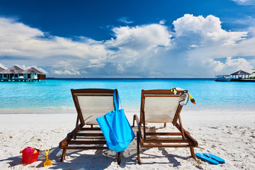 Tropical beach with sun beds