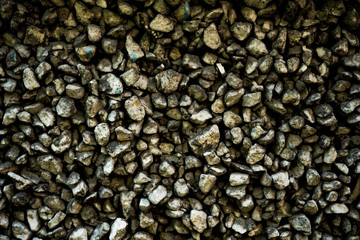 Texture photo of rough concrete plaster with sprinkled gravel